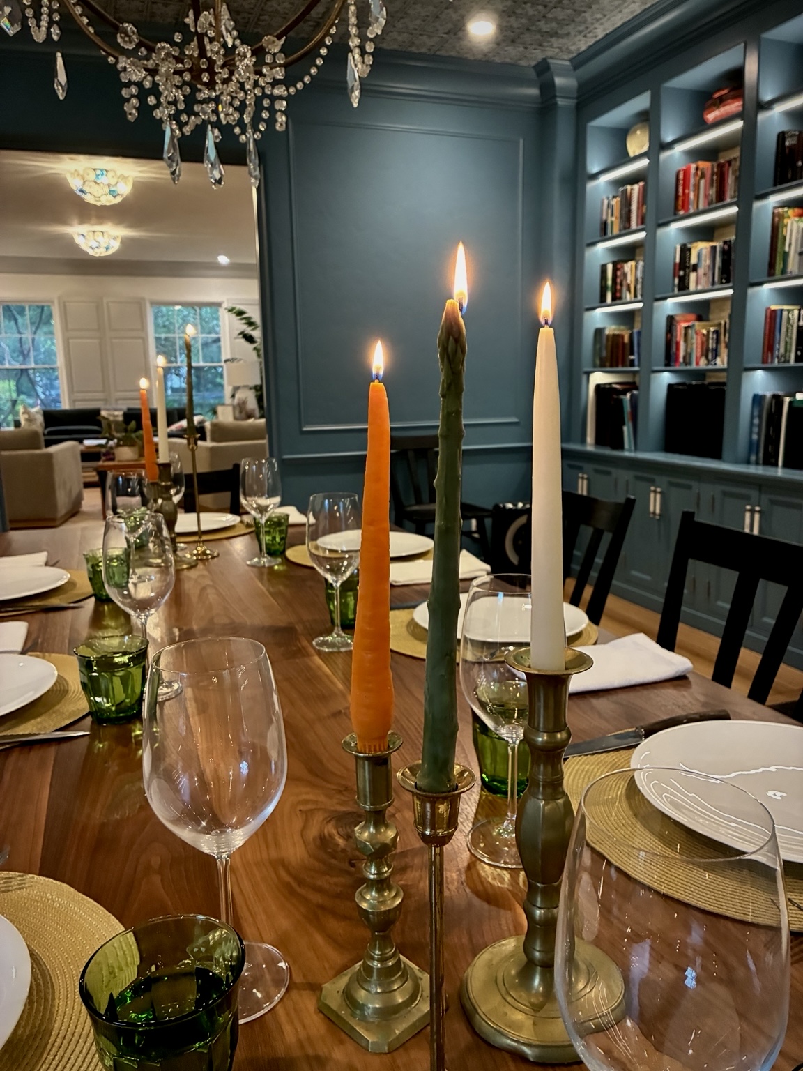 A candlelit dining table prepared for guests